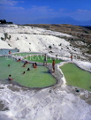 TURKEY, Pamukkale, chalkstone terraces, visitors bathing in thermal springs, TUR253JPLA