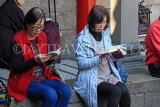 Taiwan, TAIPEI, Lungshan Temple, people reading Buddhist scriptures, TAW697JPL