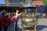 Taiwan, TAIPEI, Lungshan Temple, worshippers by incense burner censer, TAW660JPL