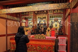 Taiwan, TAIPEI, Xia Hai City God Temple, shrine room, and worshipper, TAW924JPL