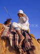 UAE, ABU DHABI, Camel race, young boy jockey on camel, UAE227JPL