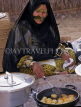 UAE, DUBAI, Bedouin woman cooking, DUB194JPL