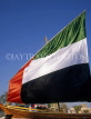 UAE, DUBAI, Dubai Heritage Village, UAE flag as sail on dhow (boat), DUB166JPL