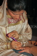 UAE, DUBAI, Henna (Mendi) design artist, painting on a hand, UAE272JPL