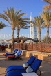 UAE, DUBAI, Madinat Jumeirah and Burj al Arab Hotel, poolside sunbeds, UAE506JPL