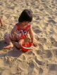 UK, Dorset, BOURNEMOUTH, beach, child palying with bucket and spade, DOR716JPL