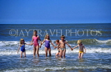 UK, Dorset, South Coast beaches, children holding hands, paddling, UK5074JPL