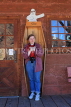 USA, California, Calico Ghost Town, tourist standing in coffin, US4869JPL