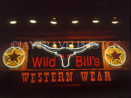 USA, Texas, DALLAS, Wild Bill's Western Wear shop, neon lit sign, DAL94JPL