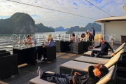 VIETNAM, Halong Bay, cruise boat, tourists relaxing on deck, VT1907JPL