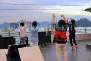 VIETNAM, Halong Bay, dawn, cruise boat, tourists practicing Tai Chi on board, VT1835JPL