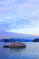VIETNAM, Halong Bay, dawn, limestone formations and moored cruise boat, VT1822JPL