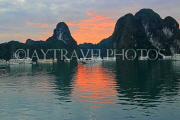 VIETNAM, Halong Bay, dawn, limestone formations and moored cruise boats, VT1809JPL