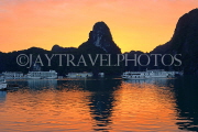 VIETNAM, Halong Bay, dawn, limestone formations and moored cruise boats, VT1815JPL