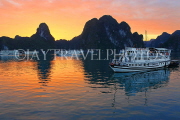 VIETNAM, Halong Bay, dawn, limestone formations and moored cruise boats, VT1816JPL