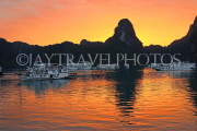 VIETNAM, Halong Bay, dawn, limestone formations and moored cruise boats, VT1817JPL