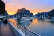 VIETNAM, Halong Bay, dawn, limestone formations and moored cruise boats, VT1824JPL