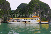 VIETNAM, Halong Bay, moored cruise boat and limestone formations, VT1852JPL