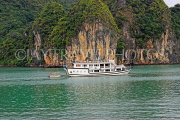 VIETNAM, Halong Bay, moored cruise boat and limestone formations, VT1853JPL