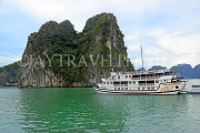 VIETNAM, Halong Bay, moored cruise boat and limestone formations, VT1854JPL