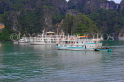 VIETNAM, Halong Bay, moored cruise boats and limestone formations, VT1851JPL