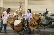 VIETNAM, Hanoi, bicycle vendor selling hats, VT553JPL