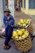 VIETNAM, Hanoi, man selling Papaya fruit, from bicycle basket, VT407JPL