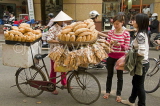 VIETNAM, Hanoi, roadside baguette vendor with bicycle, VT575JPL