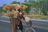 VIETNAM, Hoi An, vendor on bicycle loaded with brooms, VT701JPL