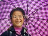 VIETNAM, Lao Cai province, Sapa, smiling Black Hmong woman under an umbrella, VT522JPL