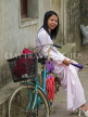 VIETNAM, Ninh Binh, woman in traditional dress with bicycle, VT518JPL