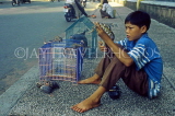 VIETNAM, Saigon (Ho Chi Minh City), boy selling pets, VT505JPL