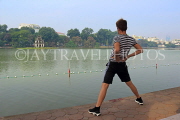 Vietnam, HANOI, Hoan Keim Lake, lakeside, and man keeping fit, VT1531JPL