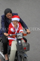 Vietnam, HANOI, biking, woman, and child in Santa costume, VT1275JPL