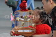 Vietnam, HANOI, child with pet bird in cage (from Bird Market), VT1762JPL