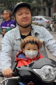 Vietnam, HANOI, father and child on bike, VT1260JPL