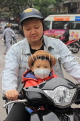 Vietnam, HANOI, father and child on bike, VT1261JPL
