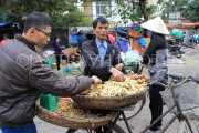 Vietnam, HANOI, outdoor market, street vendor selling yams and nuts, VT1096JPL