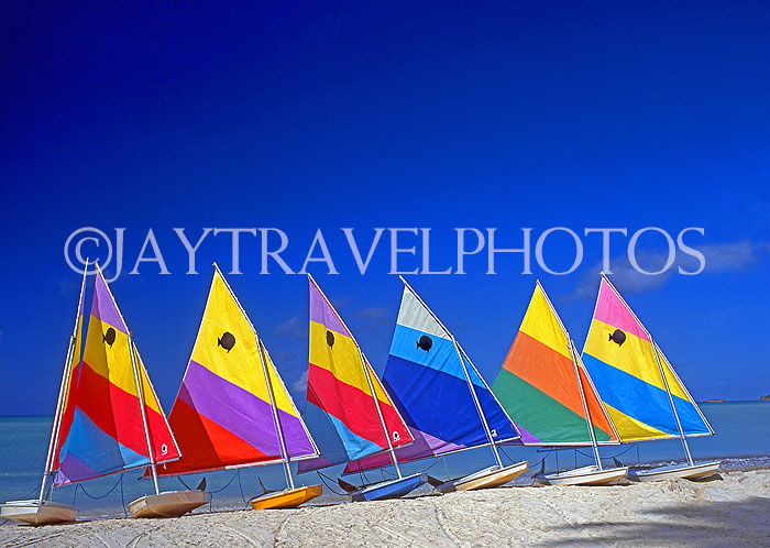 ANTIGUA, West Coast, row of sailboats lined up along beach, ANT648JPL