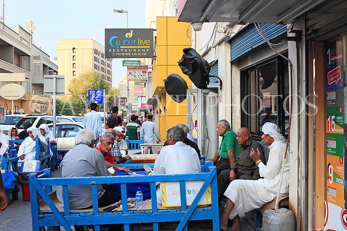 BAHRAIN, Manama, traditional coffee house, people playing cards, BHR1284JPL