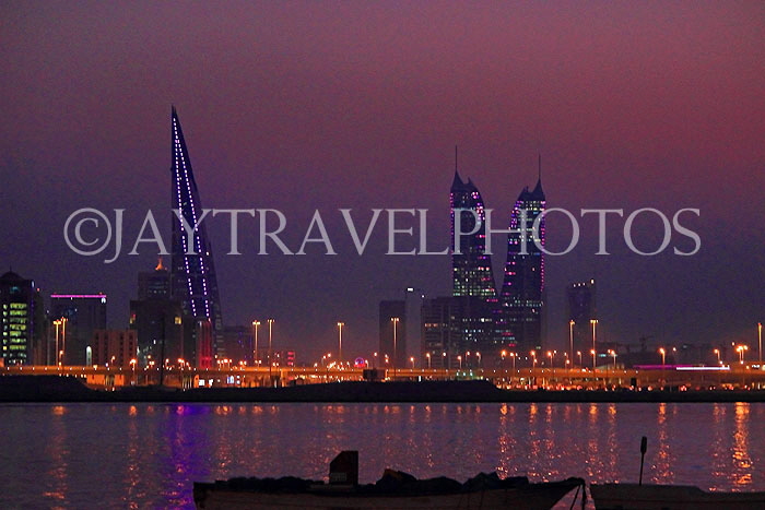 BAHRAIN, Manama night skyline, view from Muharraq coastal fishing village area, BHR2532JPL
