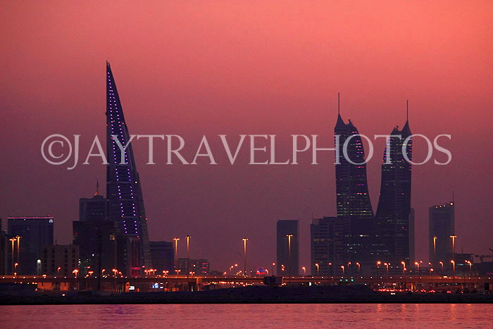 BAHRAIN, Manama night skyline, view from Muharraq coastal fishing village area, BHR2533JPL
