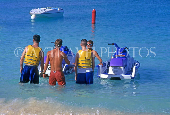 Cayman Islands, GRAND CAYMAN, tourists preparing for water scooter ride, CAY209JPL