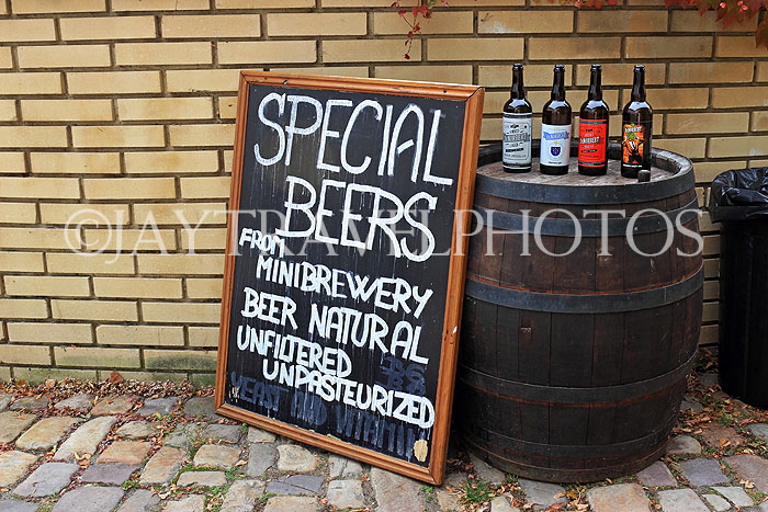 Czech Rep, PRAGUE, Mala Strana, beer bottles on display by a pub, CZ1541JPL
