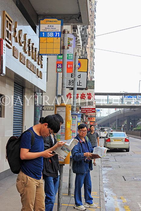 HONG KONG, Hong Kong Island, people waiting at bus stop, HK997JPL