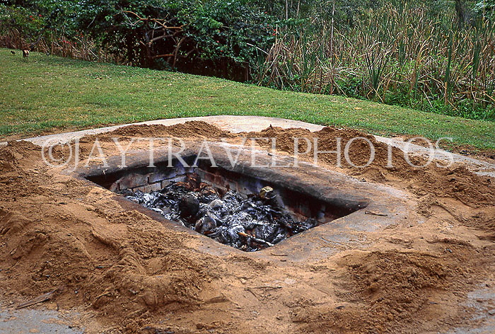 Hawaiian Islands, HAWAII (Big Island), Luau pit dug out in preperaion for feast, HAW400JPL