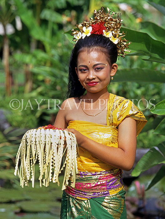 Indonesia, BALI, Balinese dancer, holding bowl of floral offerings, BAL533JPL
