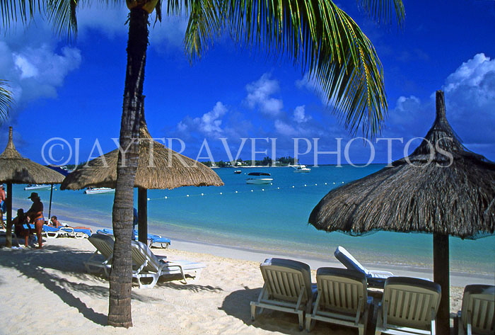 MAURITIUS, North Coast, Grand Bay, beach, thatched sunshades and sunbeds, MRU218JPL