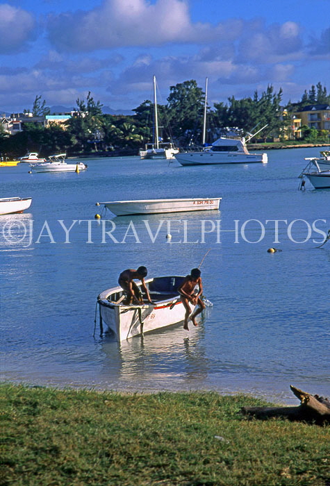 MAURITIUS, North Coast, Grand Bay, children playing in boat, MRU387JPL