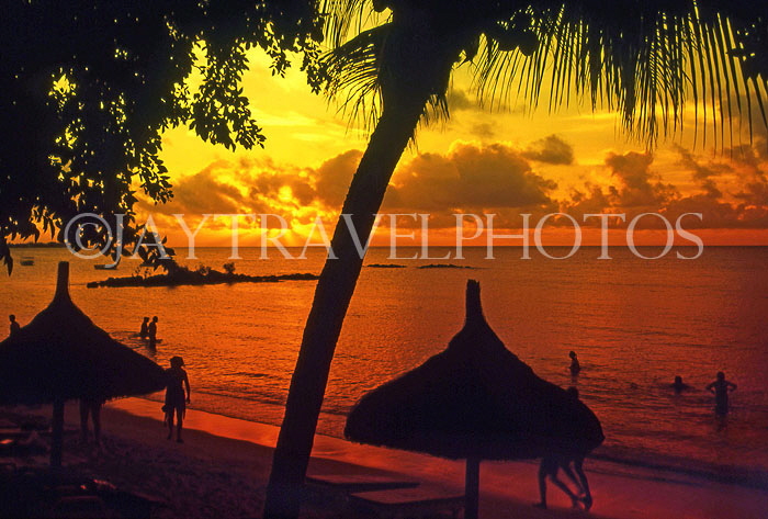 MAURITIUS, North Coast, Grand Bay, sunset with sunshade silhouettes, MRU233JPL